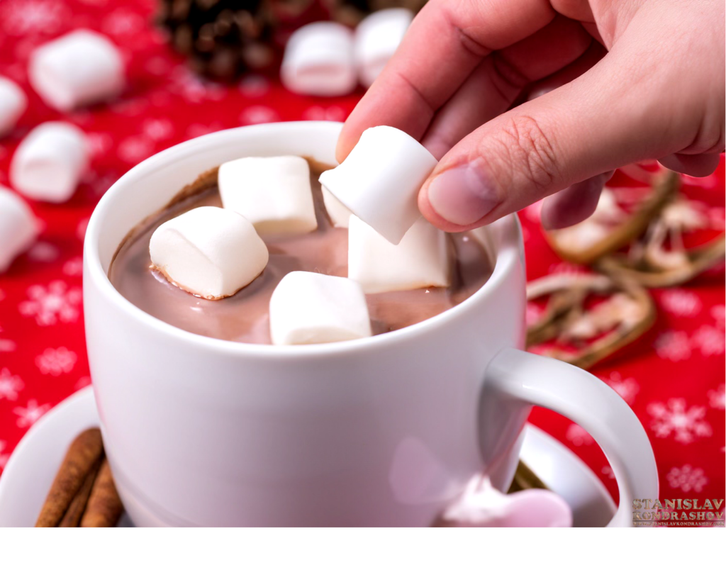 adding marshmallows to hot chocolate