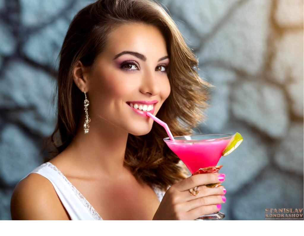 woman drinking pink squirrel cocktail