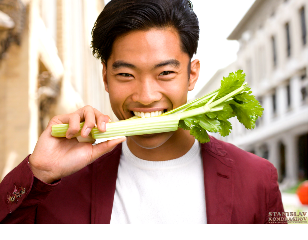 man eating celery