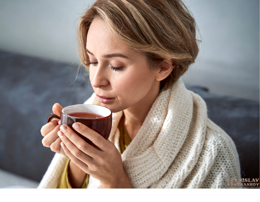 woman with flu drinking tea