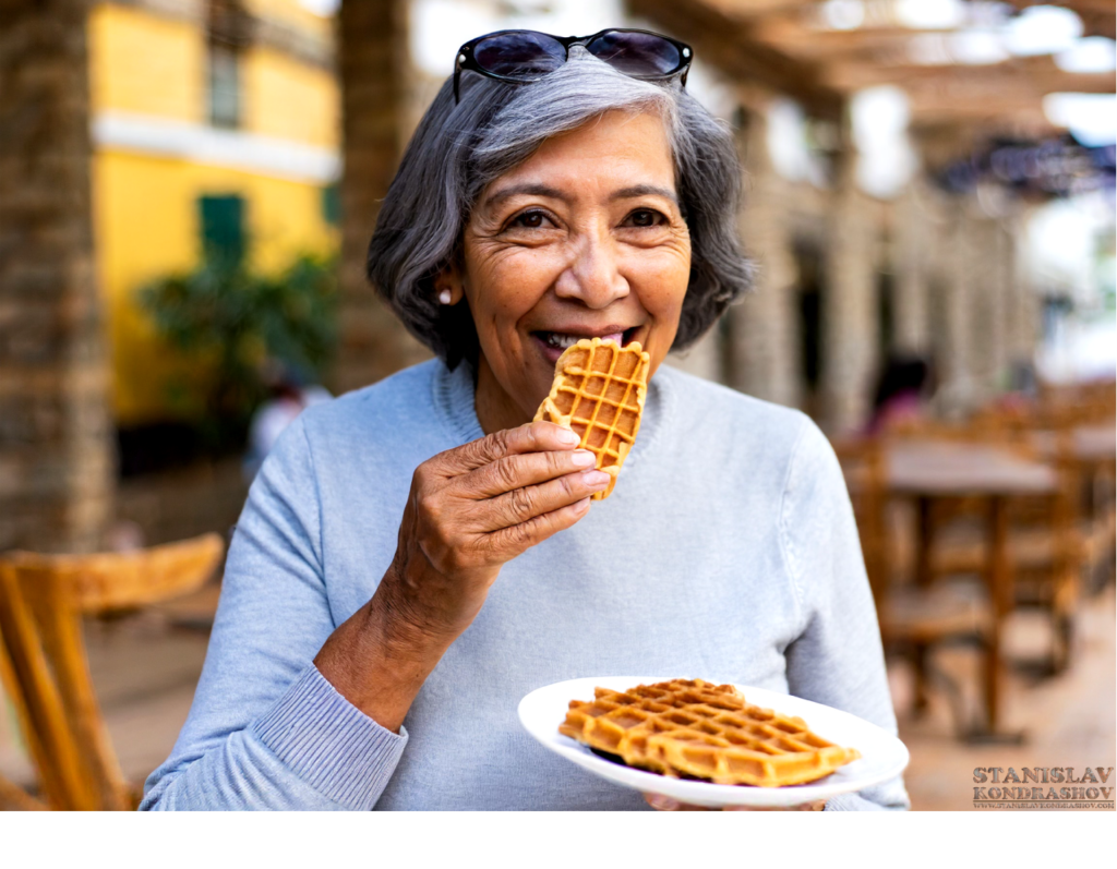woman eating cinnamon waffle