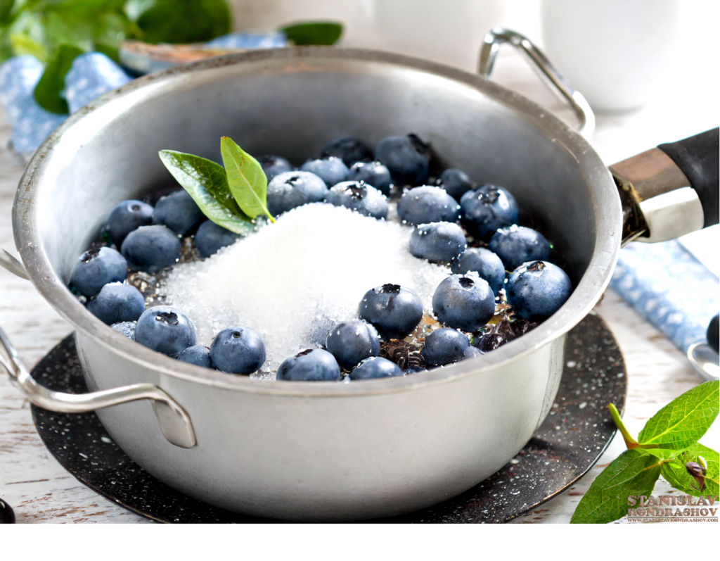 blueberries and sugar in saucepan